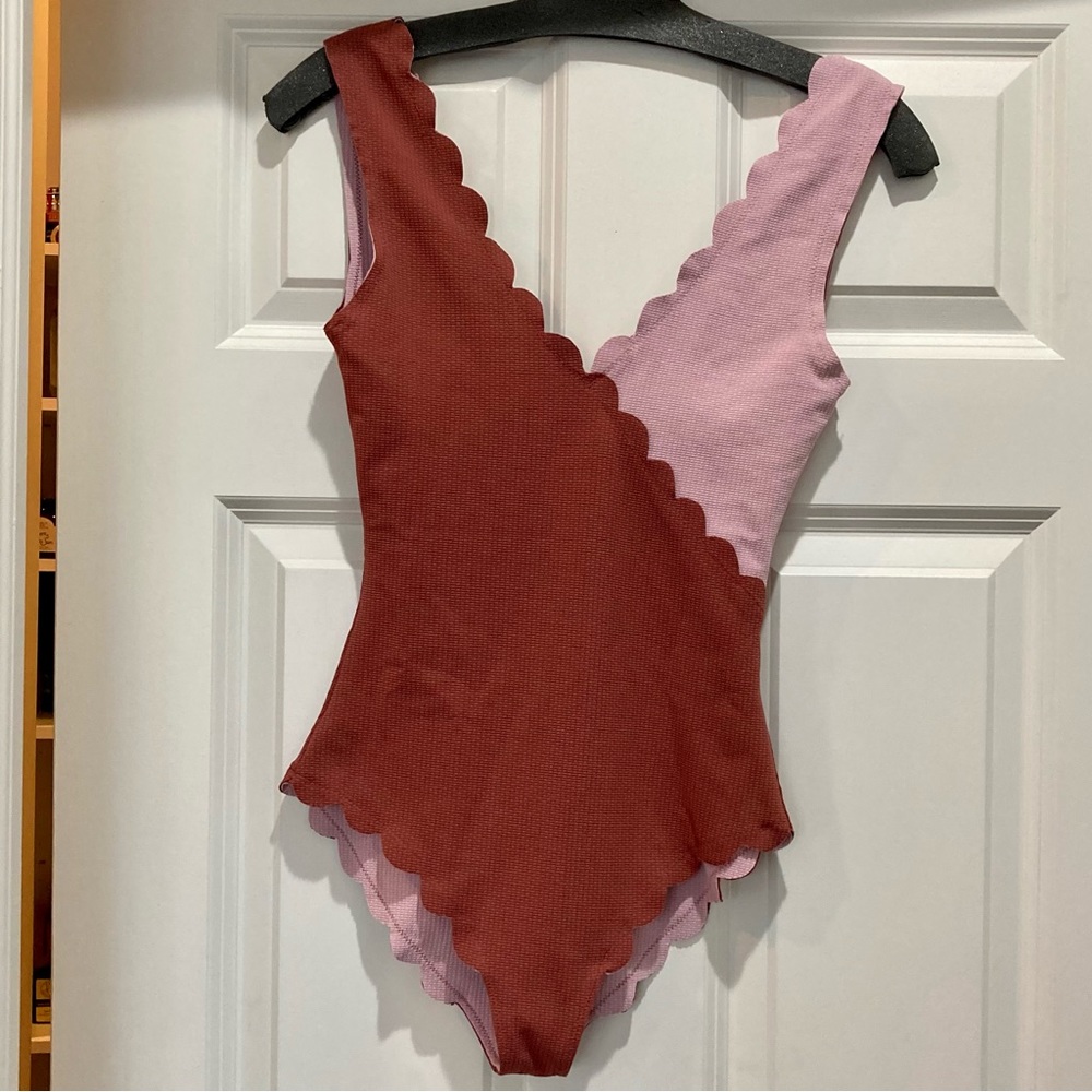 Sophisticated two-tone and reversible scallop-edge one-piece swimsuit